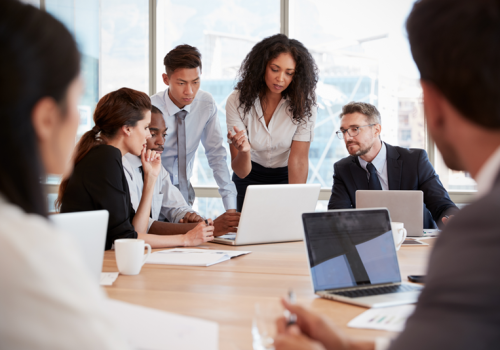 2143_team-meeting-around-table-in-office